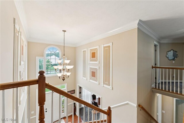 3281 Evans Way, Twinsburg, OH 44087 - corridor featuring an upstairs landing, a chandelier, and ornamental molding