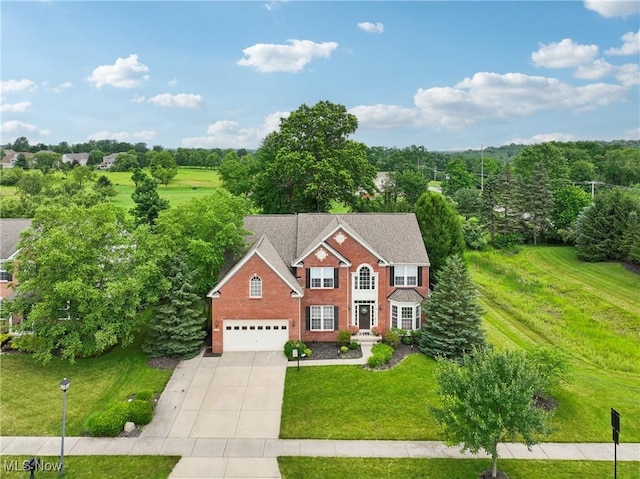 3281 Evans Way, Twinsburg, OH 44087 - view of front of property featuring driveway, a front lawn, brick siding, and an attached garage