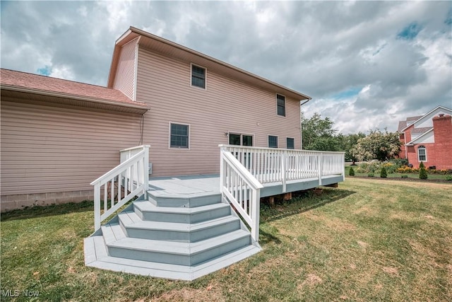2811 Canton Rd, Uniontown, OH 44685 - rear view of house with a lawn and a wooden deck