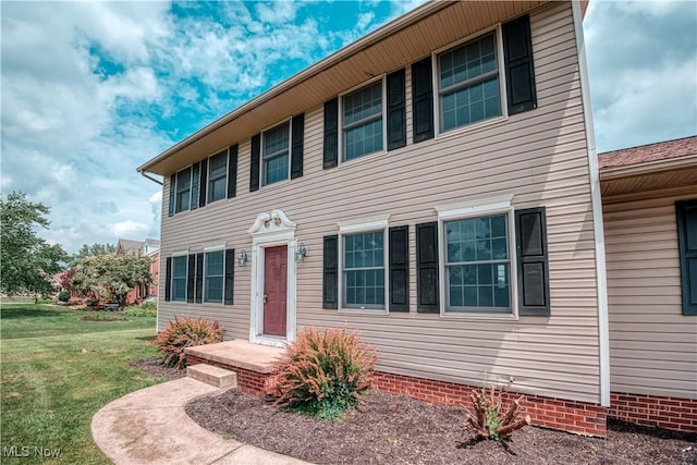 2811 Canton Rd, Uniontown, OH 44685 - colonial-style house featuring a front yard