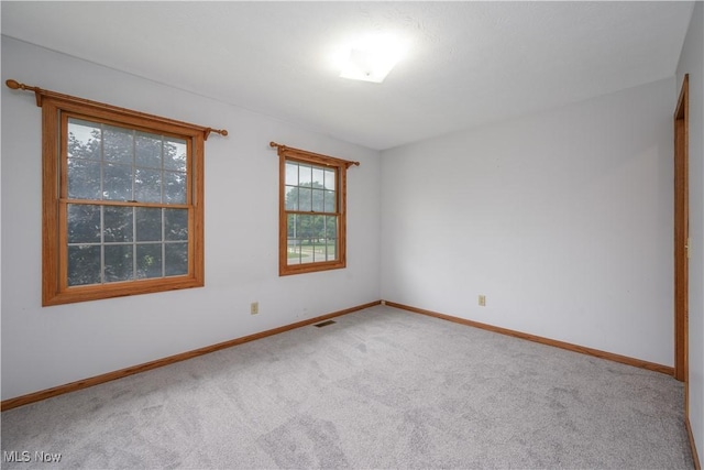 2811 Canton Rd, Uniontown, OH 44685 - carpeted empty room featuring baseboards