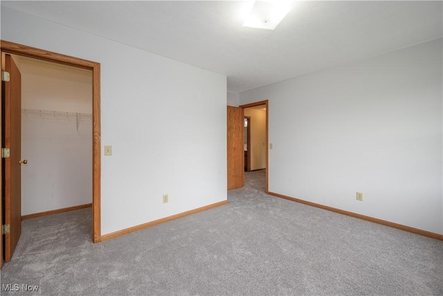 2811 Canton Rd, Uniontown, OH 44685 - spare room with carpet floors and baseboards