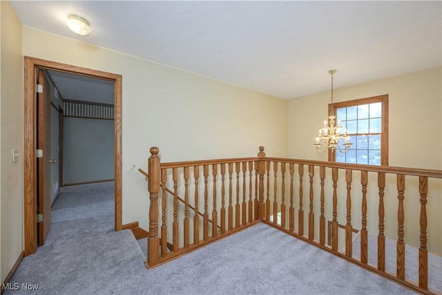 2811 Canton Rd, Uniontown, OH 44685 - hall with an upstairs landing, a chandelier, and carpet