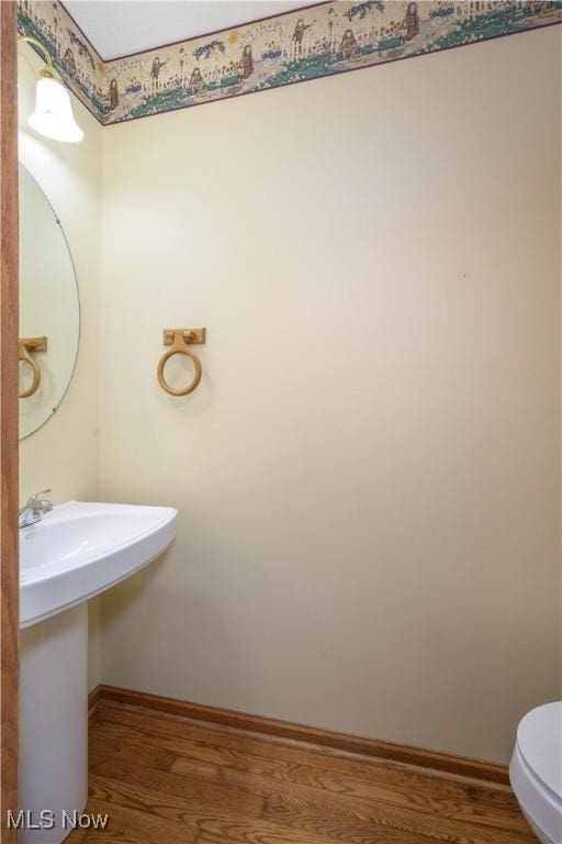 2811 Canton Rd, Uniontown, OH 44685 - bathroom with wood finished floors and toilet