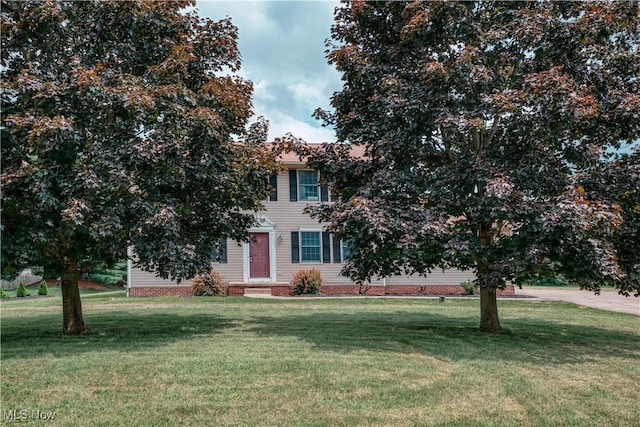 2811 Canton Rd, Uniontown, OH 44685 - view of property hidden behind natural elements featuring a front yard