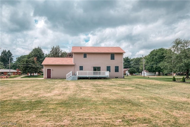 2811 Canton Rd, Uniontown, OH 44685 - back of house featuring a lawn and a wooden deck