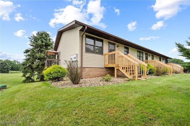 1222 Schneiders Crossing Rd NW # C, Dover, OH 44622 - rear view of property featuring a yard