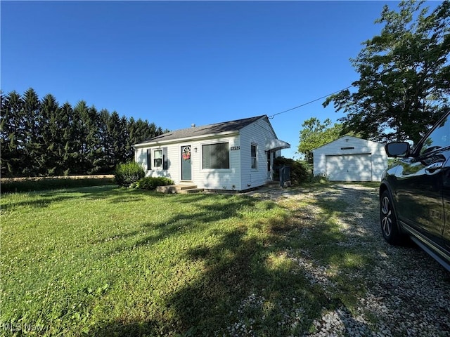 14782 Hametown Rd, Doylestown, OH 44230 - view of front of home featuring an outbuilding, a garage, driveway, a front yard, and entry steps
