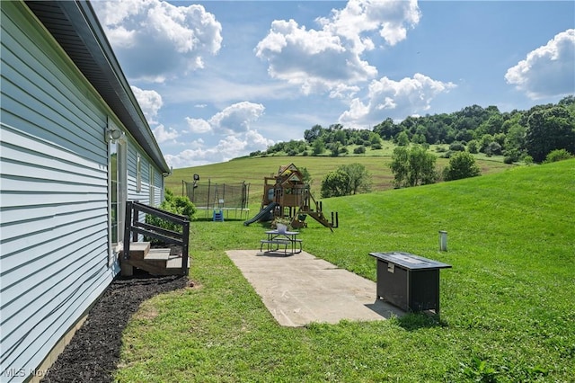 4216 Stone Creek Rd SW, Stone Creek, OH 43840 - view of green lawn featuring a playground and a patio