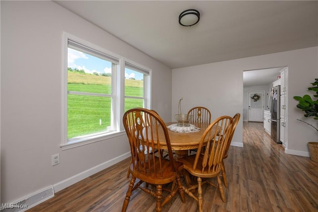 4216 Stone Creek Rd SW, Stone Creek, OH 43840 - dining area featuring baseboards and dark wood-style flooring