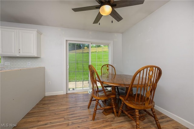 4216 Stone Creek Rd SW, Stone Creek, OH 43840 - dining room with wood finished floors, ceiling fan, and vaulted ceiling