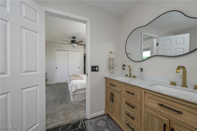 4216 Stone Creek Rd SW, Stone Creek, OH 43840 - full bathroom with double vanity, ceiling fan, ensuite bathroom, and marble finish flooring