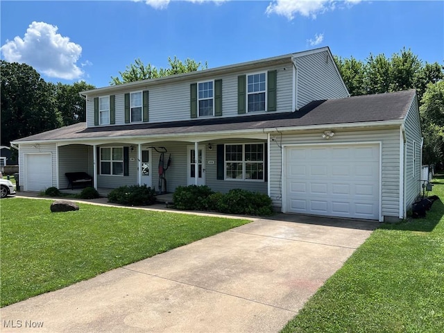 678 Highland Dr, Lodi, OH 44254 - view of front of property featuring a garage, driveway, a front yard, and covered porch