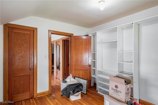 1055 W Virginia Ave, Parkersburg, WV 26104 - unfurnished bedroom with light wood finished floors and vaulted ceiling