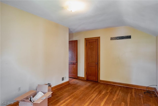 1055 W Virginia Ave, Parkersburg, WV 26104 - unfurnished room with light wood-style flooring and vaulted ceiling