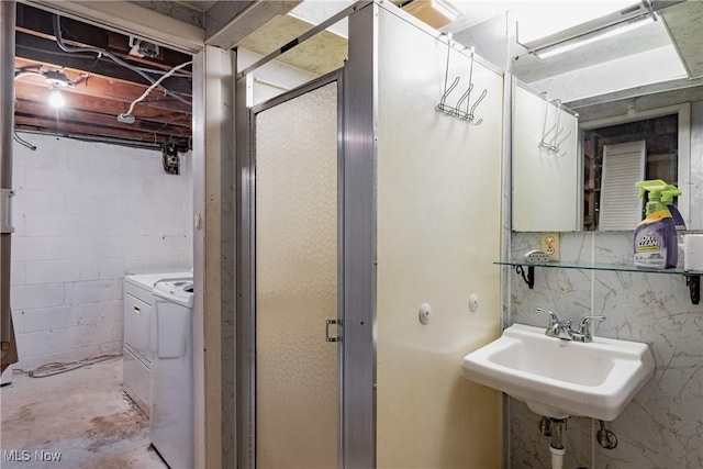 1055 W Virginia Ave, Parkersburg, WV 26104 - bathroom featuring separate washer and dryer, concrete flooring, and a stall shower