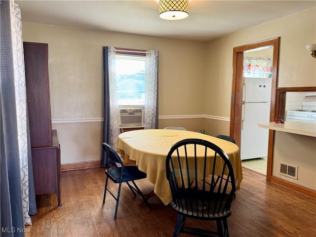1055 W Virginia Ave, Parkersburg, WV 26104 - dining area featuring wood finished floors and cooling unit