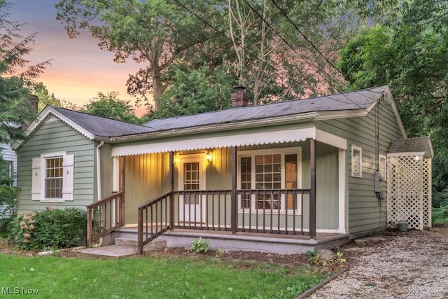 2968 Hayne Rd, Akron, OH 44312 - view of front of house featuring covered porch and a chimney