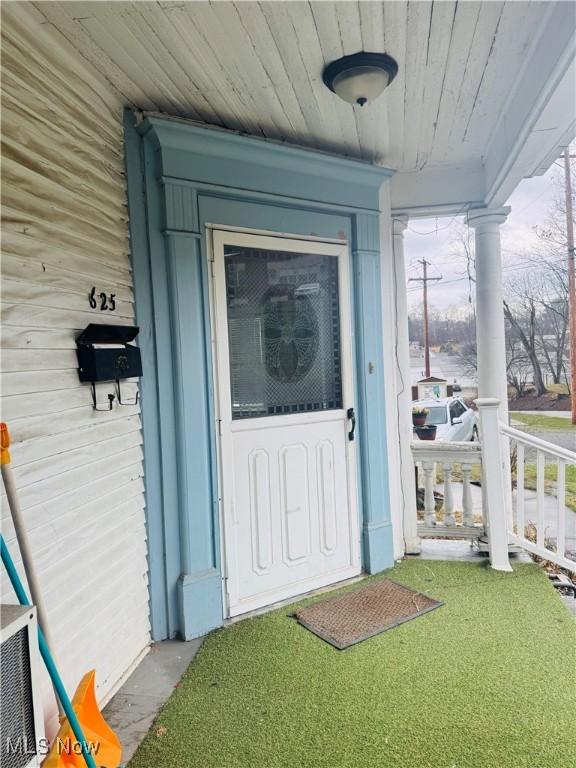 625 Main St, Caldwell, OH 43724 - entrance to property featuring a porch