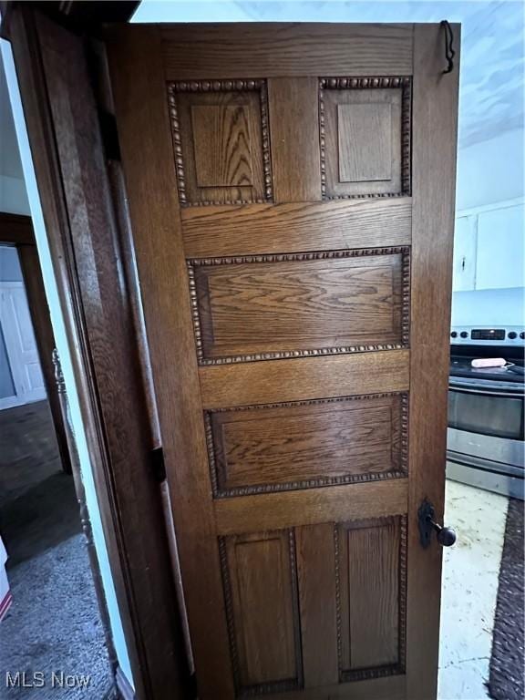 625 Main St, Caldwell, OH 43724 - detailed view of stainless steel range with electric cooktop