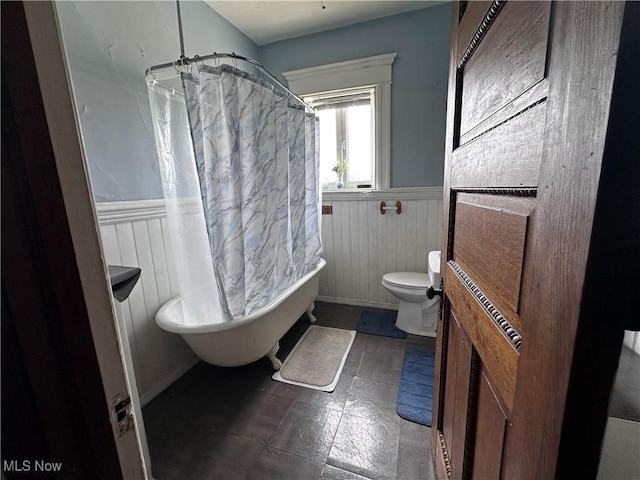 625 Main St, Caldwell, OH 43724 - full bathroom with a wainscoted wall and toilet