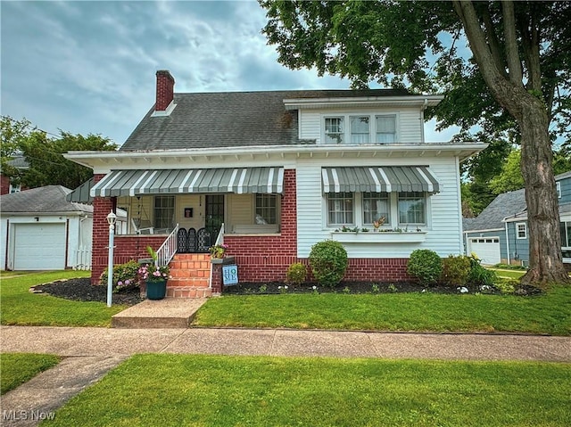 2208 Oak St, Parkersburg, WV 26101 - view of front of property with a porch, a front lawn, a chimney, a garage, and roof with shingles