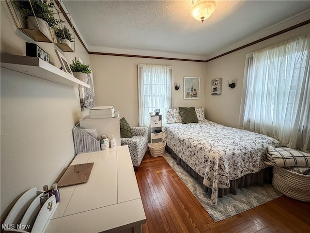 2208 Oak St, Parkersburg, WV 26101 - bedroom with ornamental molding, wood-type flooring, and a textured ceiling