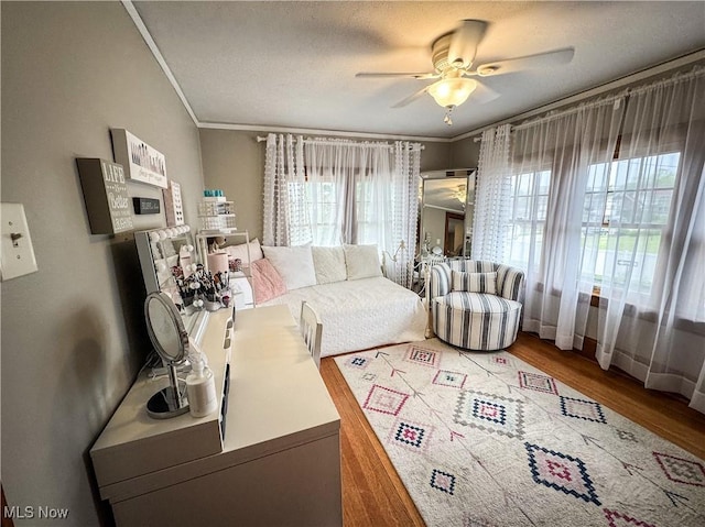 2208 Oak St, Parkersburg, WV 26101 - living area featuring a ceiling fan, wood finished floors, and crown molding