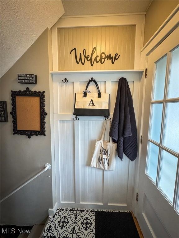 2208 Oak St, Parkersburg, WV 26101 - mudroom with a textured ceiling and tile patterned floors