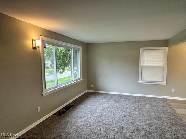 4514 Lilac Rd, South Euclid, OH 44121 - unfurnished room featuring baseboards and dark colored carpet