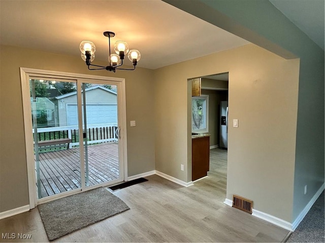 4514 Lilac Rd, South Euclid, OH 44121 - entryway with a chandelier and wood finished floors