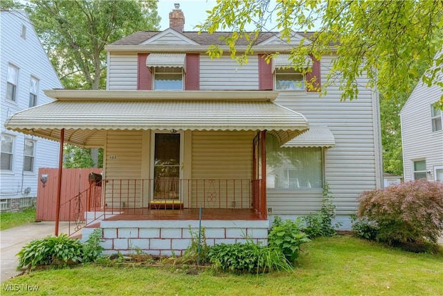 868 Davies Ave, Akron, OH 44306 - view of front of property featuring covered porch, a chimney, and a front yard