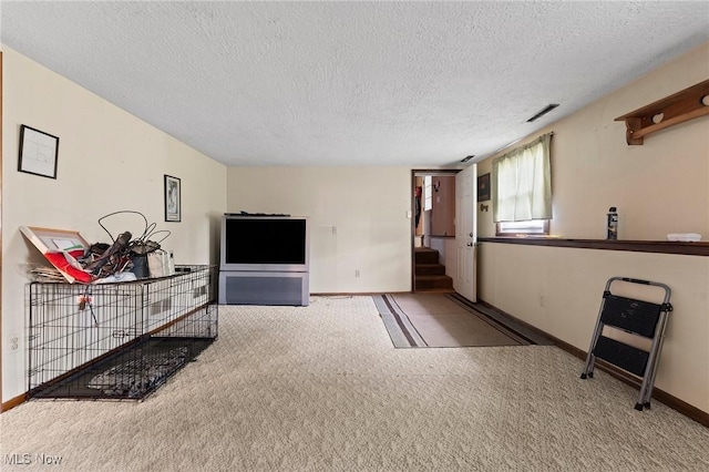 1781 Old Forge Rd, Mogadore, OH 44260 - carpeted living area featuring a textured ceiling and stairs