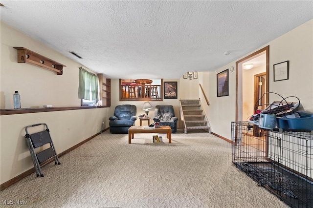 1781 Old Forge Rd, Mogadore, OH 44260 - living area with carpet, stairs, and a textured ceiling