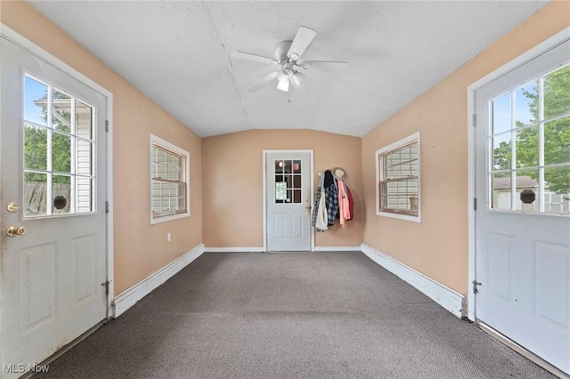 1781 Old Forge Rd, Mogadore, OH 44260 - foyer entrance featuring dark carpet, ceiling fan, and lofted ceiling