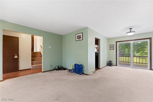 1781 Old Forge Rd, Mogadore, OH 44260 - carpeted empty room with stairs and baseboards