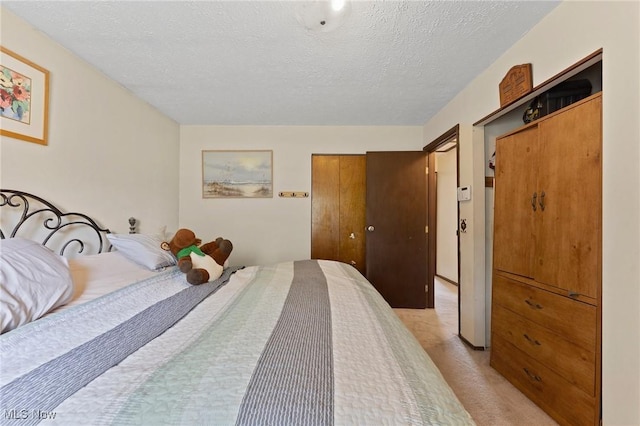 1781 Old Forge Rd, Mogadore, OH 44260 - bedroom featuring a textured ceiling and light colored carpet