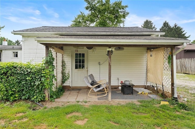 1781 Old Forge Rd, Mogadore, OH 44260 - rear view of house with a patio area and roof with shingles