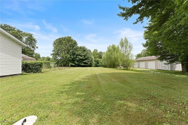 1781 Old Forge Rd, Mogadore, OH 44260 - view of grassy yard with a detached garage and an outbuilding