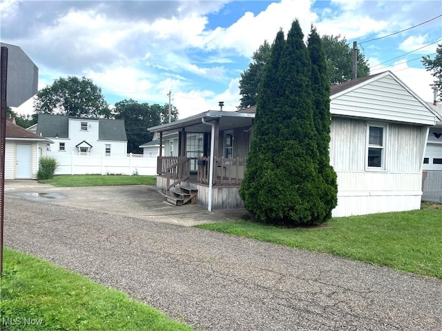 310 Jackson St, Minerva, OH 44657 - view of front facade with covered porch