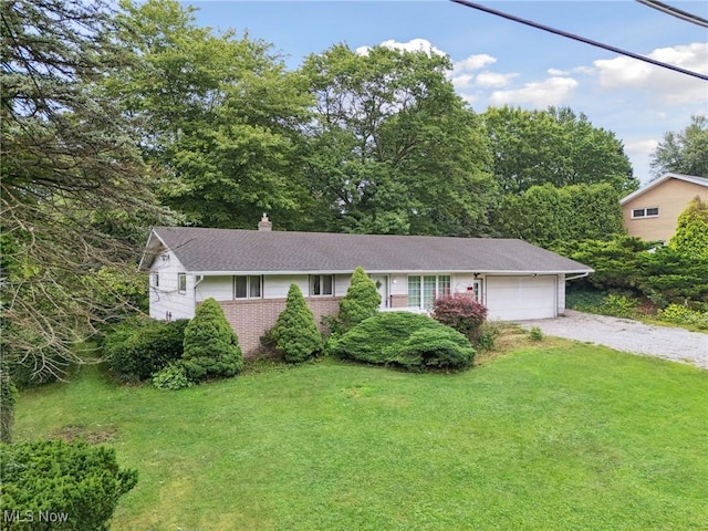 4524 Sherer Ave SW, Canton, OH 44706 - single story home with gravel driveway, an attached garage, a chimney, and a front yard