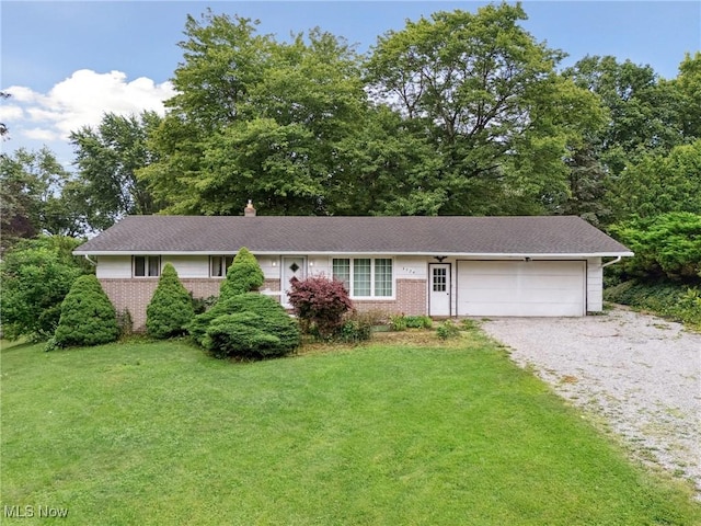 4524 Sherer Ave SW, Canton, OH 44706 - single story home featuring brick siding, a garage, and a front yard