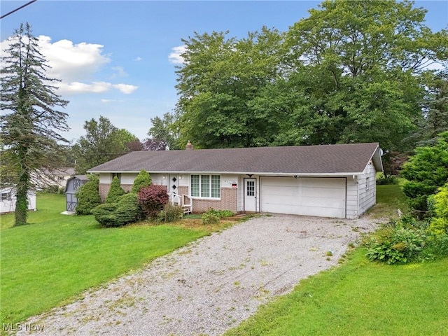 4524 Sherer Ave SW, Canton, OH 44706 - ranch-style home with a garage, gravel driveway, and a front yard