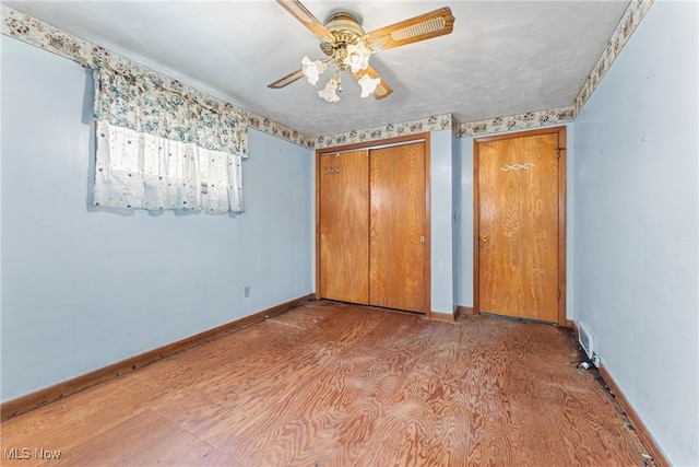4524 Sherer Ave SW, Canton, OH 44706 - unfurnished bedroom featuring a closet and ceiling fan