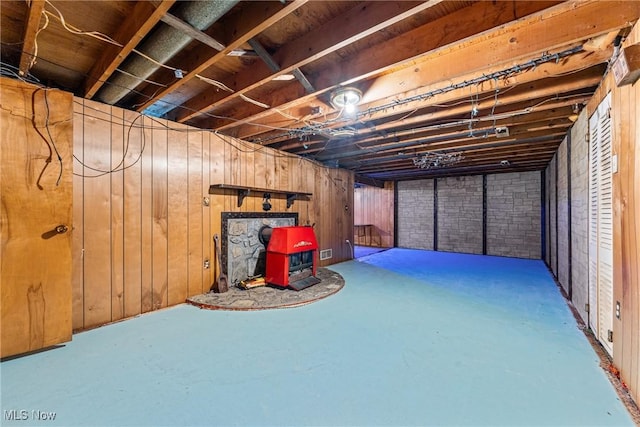 4524 Sherer Ave SW, Canton, OH 44706 - unfinished below grade area with a wood stove and wood walls
