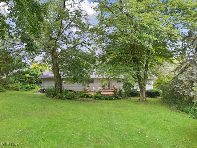 4524 Sherer Ave SW, Canton, OH 44706 - view of green lawn with a deck