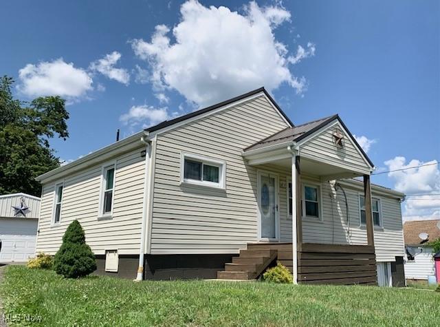 62 Township Road 245, Toronto, OH 43964 - view of front of property featuring a porch, an outbuilding, and a front lawn
