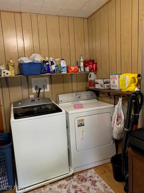 62 Township Road 245, Toronto, OH 43964 - laundry area featuring washer and dryer, wood finished floors, and wood walls