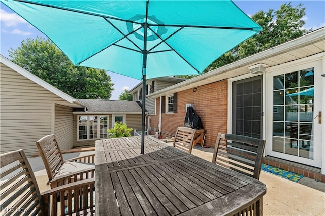2615 Daffodil St NE, Canton, OH 44705 - wooden deck with outdoor dining space and entry steps