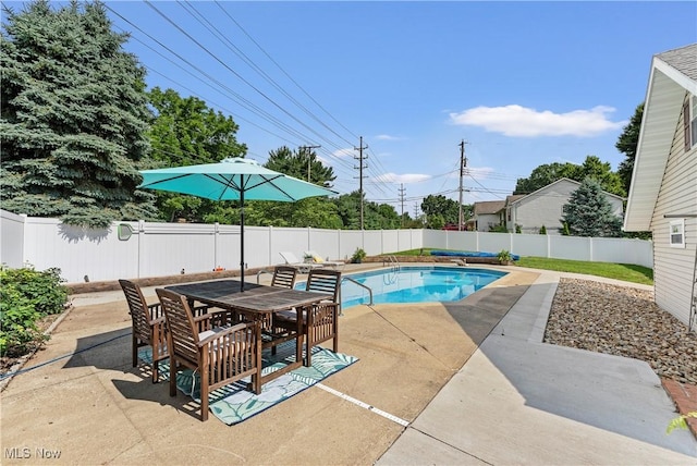 2615 Daffodil St NE, Canton, OH 44705 - view of pool featuring a patio area, a fenced backyard, and outdoor dining area
